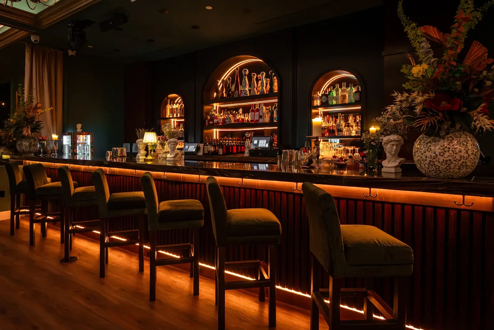 Illuminated cocktail bar and velvet seating at Leonardo in Miami Beach