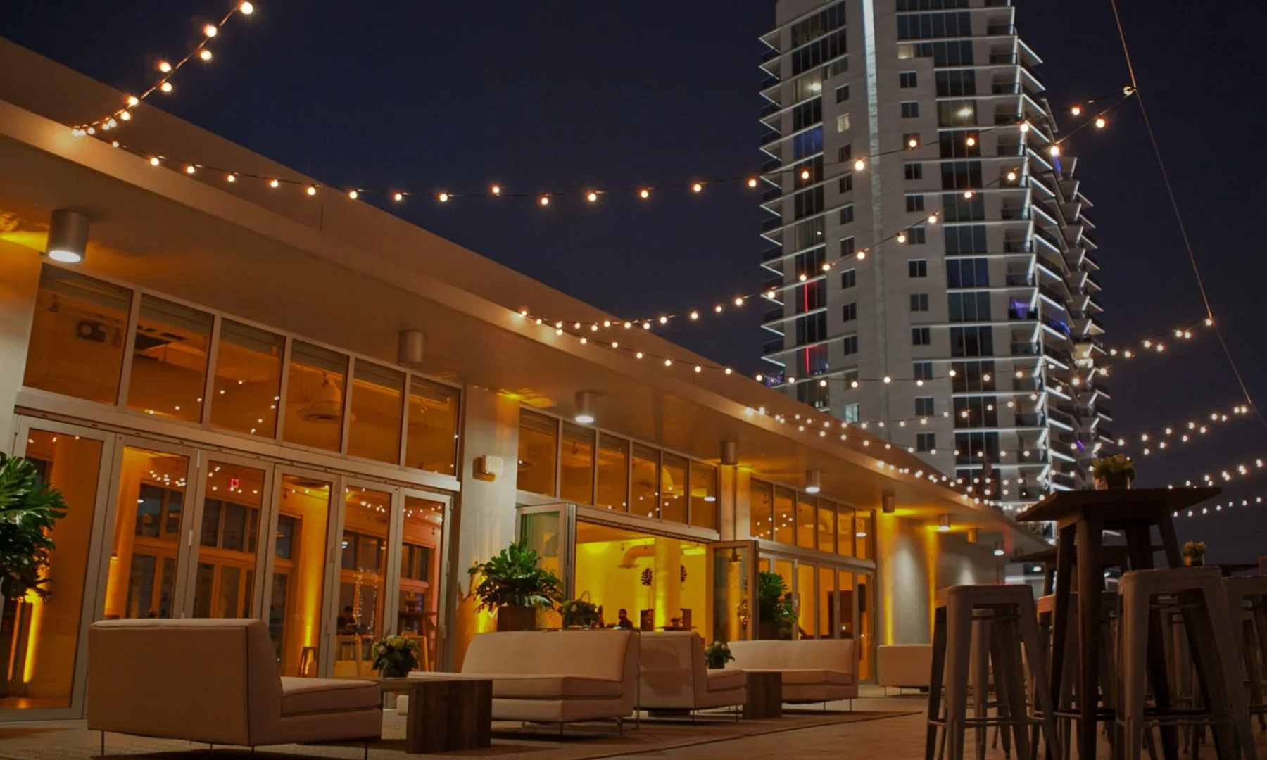 The Penthouse at Riverside Wharf illuminated rooftop terrace at night