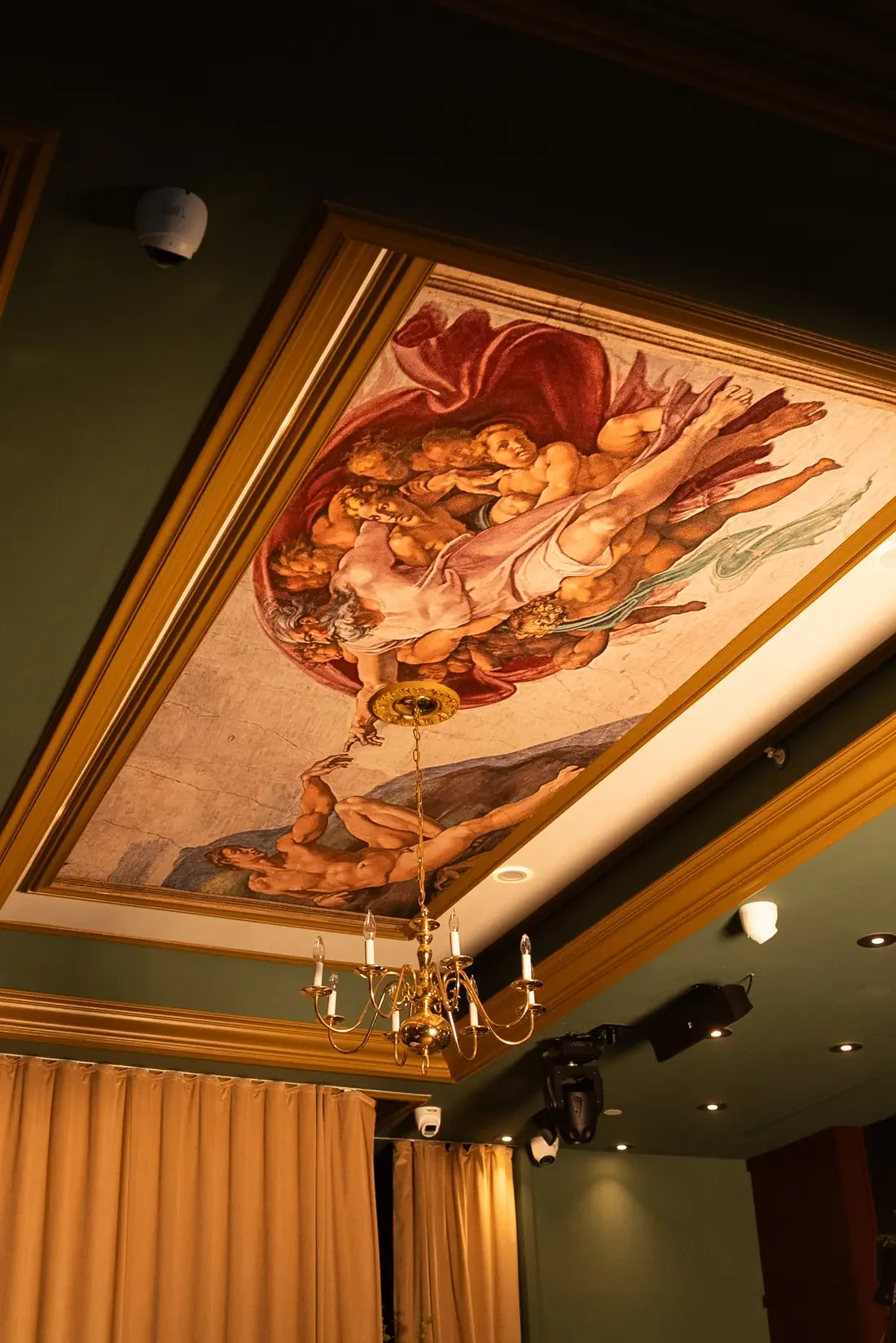 Painted ceiling fresco, chandelier and installed lighting at Leonardo Miami Beach