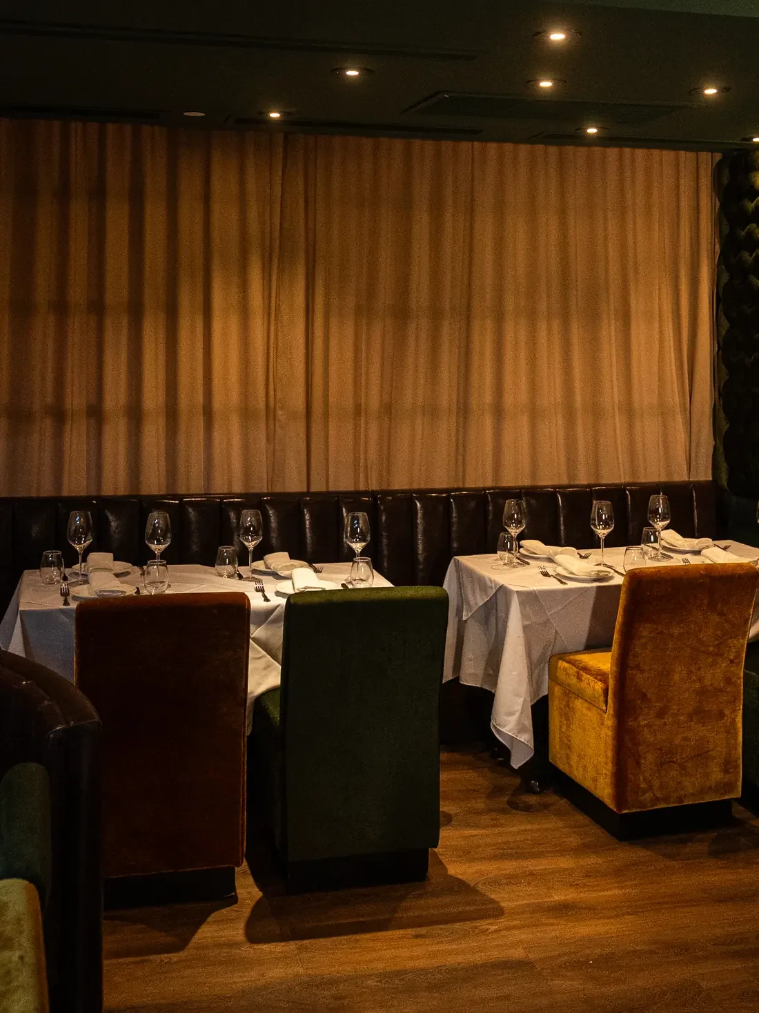 Intimate dining nook with velvet chairs at Leonardo Miami Beach